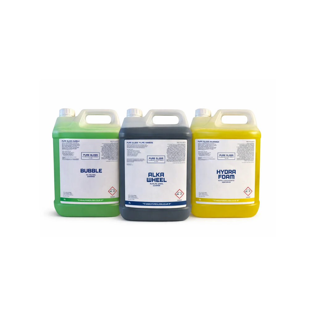 Three large bottles of car shampoo, wheel cleaner, and pre wash car care products